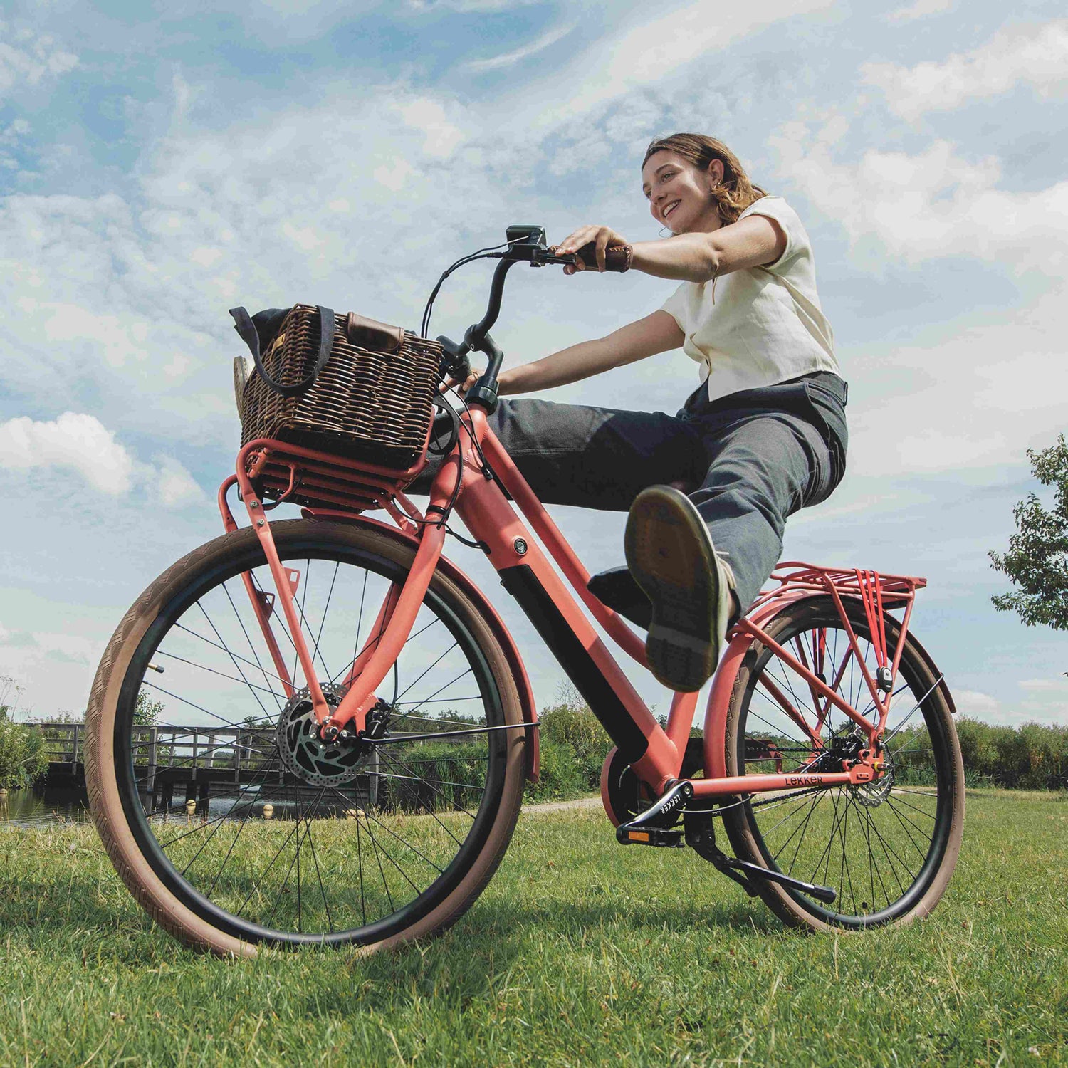 Girl smiling on carmine red Jordaan plus Lekker Bike ebike